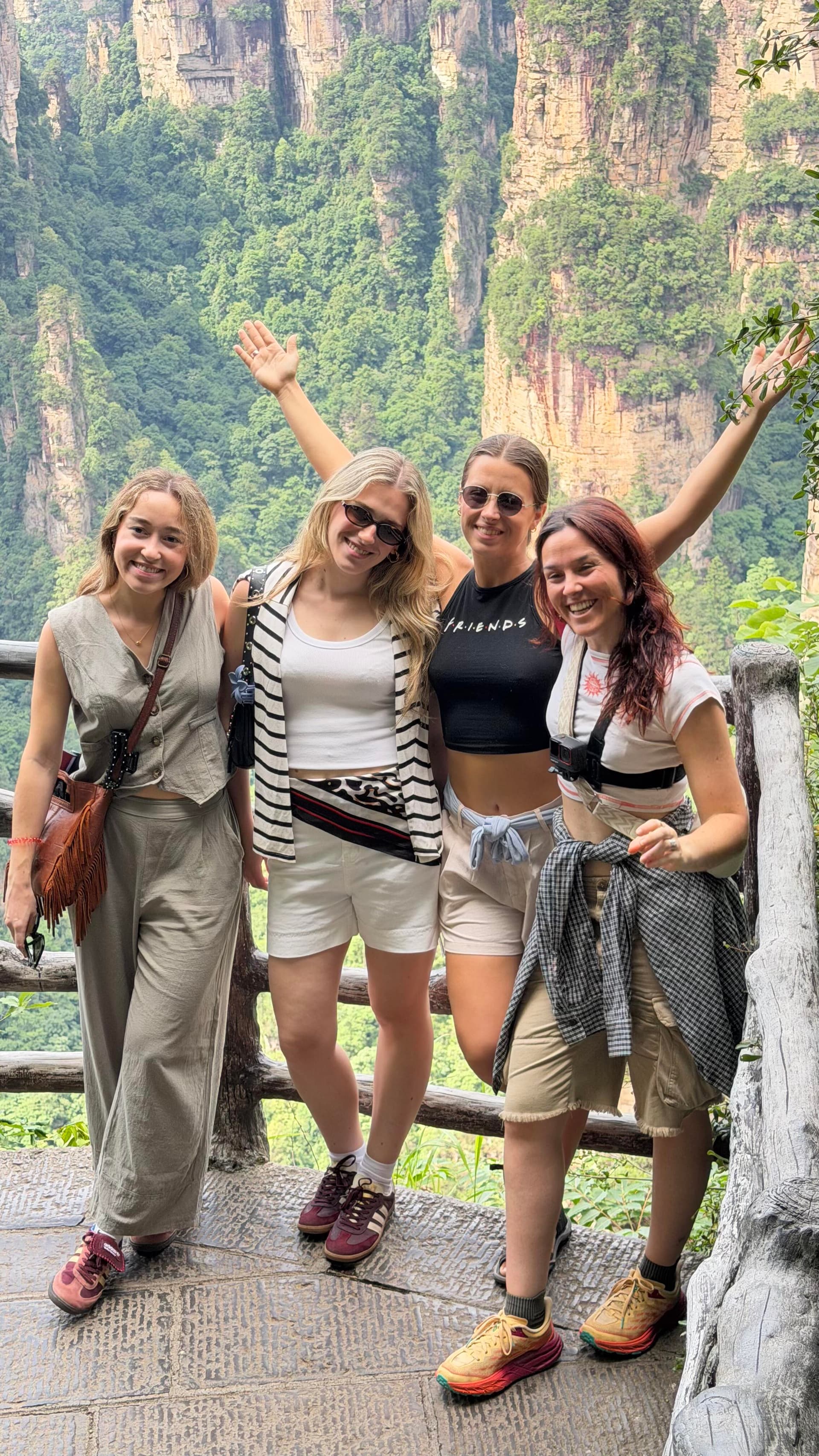 International travelers taking in the sandstone peaks of Zhangjiajie
